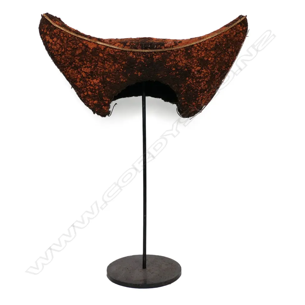 A PNG Huli Tribe bachelor's headdress of red ochre-stained human hair, typical crescent form. With iron stand. W.420mm Image 1++
